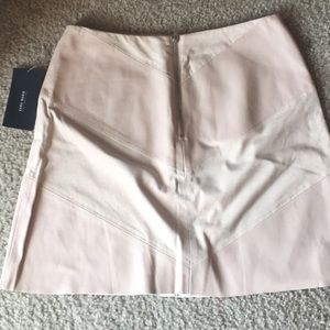 A women’s unused light pink/nude mini skirt